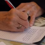 Hand, writing a letter