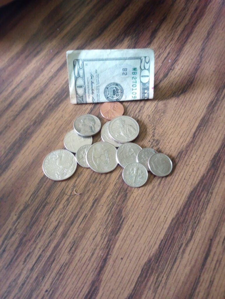 $20 bill and some coins