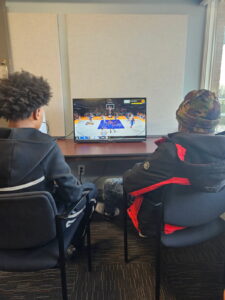 2 Young People Gaming at the Center
