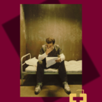 Man on a bunk reading a letter